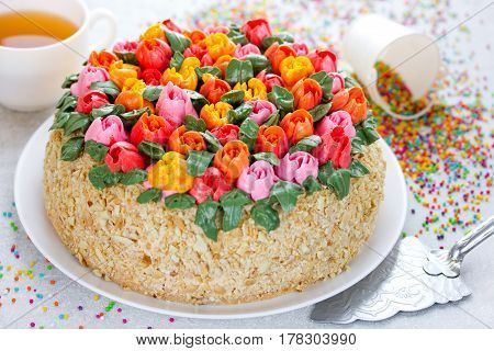 Buttercream flower tulip cake beautiful festive cake decorated with colorful cream flowers for spring holidays