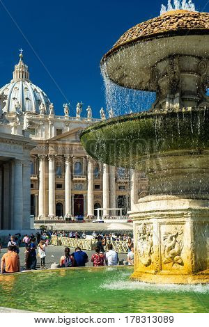 ROME, ITALY - OCTOBER 5, 2012: Fountain in front of the Basilica of Saint Peter.