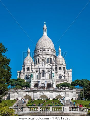 PARIS - SEPTEMBER 24, 2013: Basilica of the Sacred Heart of Jesus (Basilique du Sacre-Coeur). A popular landmark it is located at the summit of the Montmartre hill the highest point in Paris.