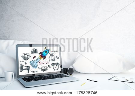 Close up of laptop with business drawing on screen placed on white surface with pillows coffee cup and other items. Success concept. 3D Rendering