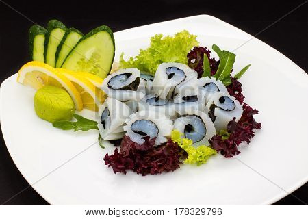 sashimi sushi set with soy on black background