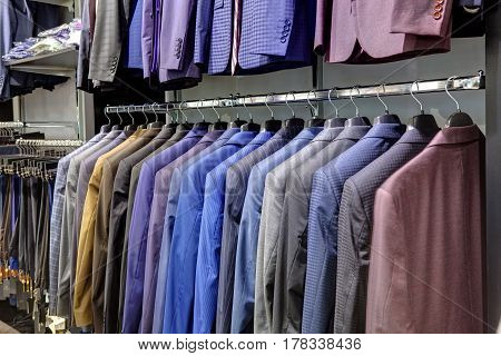 jackets hang in a row in the store