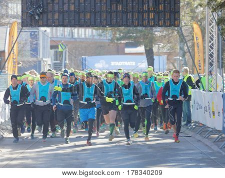 STOCKHOLM SWEDEN - MAR 25 2017: Running people after the start in the Stockholm Tunnel Run Citybanan 2017. March 25 2017 in Stockholm Sweden