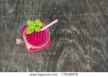 Smoothies Of A Red Organic Dragon Fruit On An Old Wooden Background