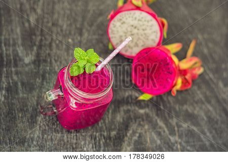 Smoothies Of A Red Organic Dragon Fruit On An Old Wooden Background