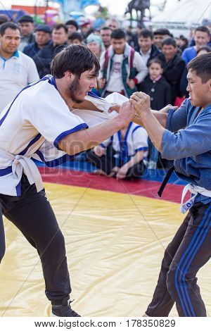 Shymkent, KAZAKHSTAN - 22 March 2017: Celebration of the Kazakh holiday NARIYZ. Competition wrestlers .
