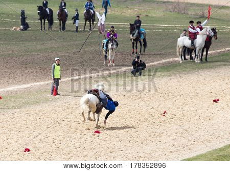 Shymkent, KAZAKHSTAN - 22 March 2017: Celebration of the Kazakh holiday NARIYZ. Competitions on horses .