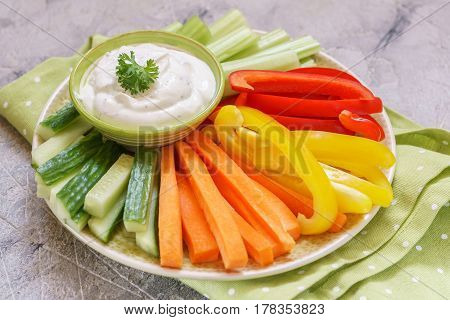 Platter of assorted fresh vegetables with ranch dip