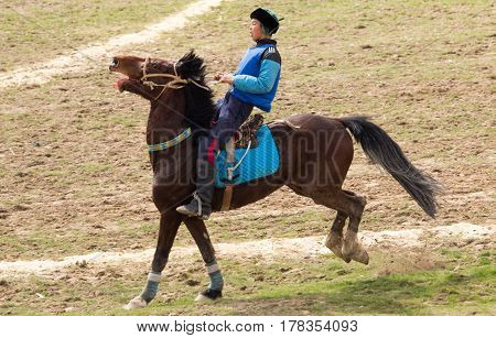 Shymkent, KAZAKHSTAN - 22 March 2017: Celebration of the Kazakh holiday NARIYZ. Competitions on horses .