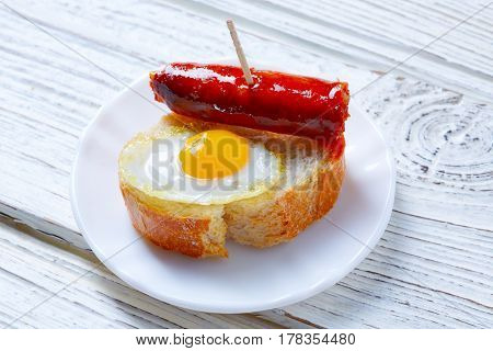 pinchos pintxos chistorra with quail egg tapas from Spain sausage food