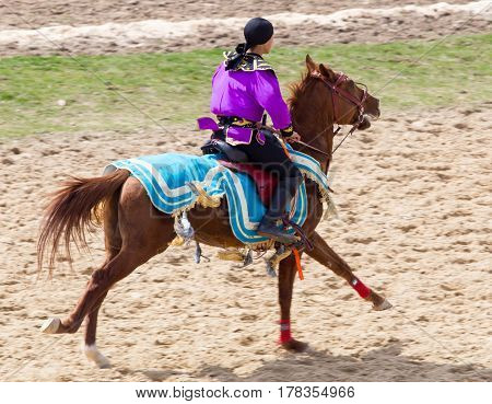 Shymkent, KAZAKHSTAN - 22 March 2017: Celebration of the Kazakh holiday NARIYZ. Competitions on horses .