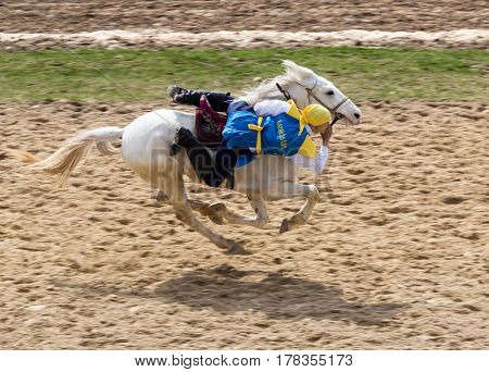 Shymkent, KAZAKHSTAN - 22 March 2017: Celebration of the Kazakh holiday NARIYZ. Competitions on horses .