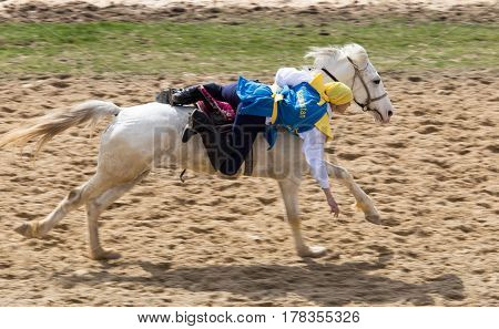 Shymkent, KAZAKHSTAN - 22 March 2017: Celebration of the Kazakh holiday NARIYZ. Competitions on horses .