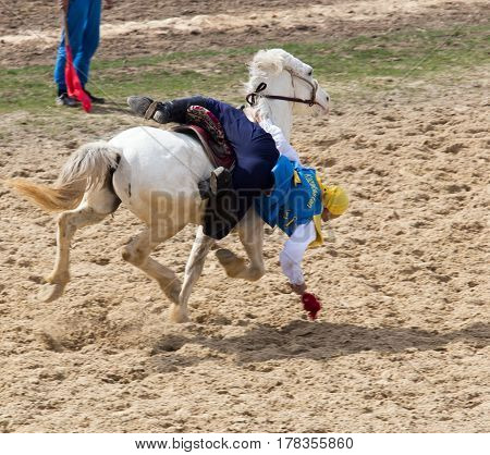 Shymkent, KAZAKHSTAN - 22 March 2017: Celebration of the Kazakh holiday NARIYZ. Competitions on horses .