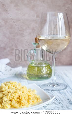 Portion Of Risotto With Glass Of White Wine