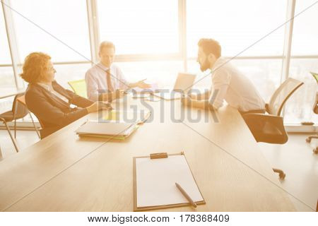 Toned of business people communicating with new worker and suggesting him appropriate contract to work in huge company, firm, enterprise. Employee concept.