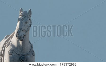 Large off white Horse Statue with blue background