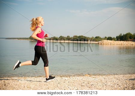 Jogging In Th Beach - Woman Runns Near Sea On Early Summer Morning