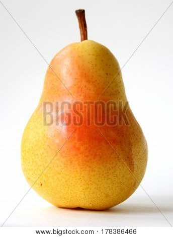 Single yellow pear, isolated on white background