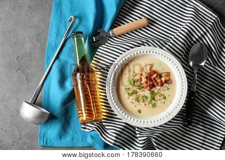 Delicious cream soup with bacon on table