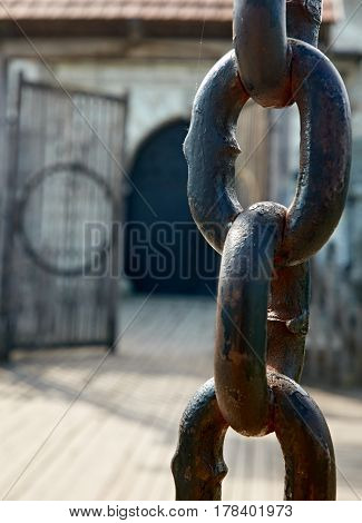 Close up photo of old gate chain in Dubno, Ukraine
