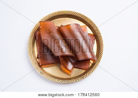 indian alphonso mango's dried jelly called mango papad or mango poli or slab or cake, traditional maharashtrian recipe