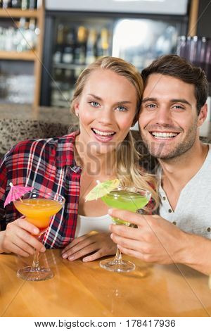 Couple head to head smiling in a bar