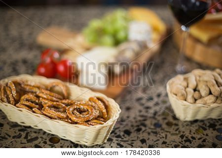 Wine glass and a buch of food in a bar