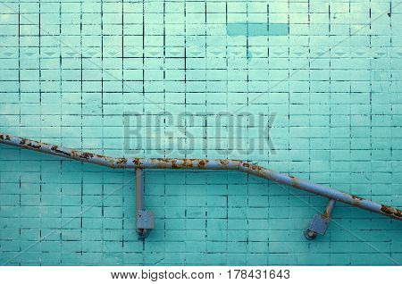Painted Tile Wall Texture with Metal Railing for Background or Copy Space.