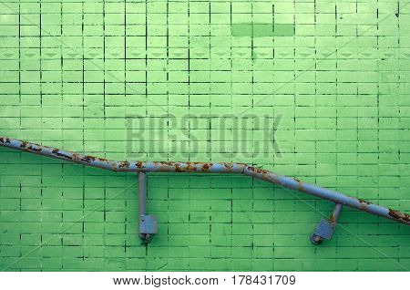 Painted Tile Wall Texture with Metal Railing for Background or Copy Space.