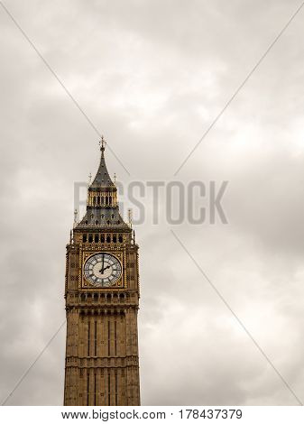 The iconic London landmark Big Ben at 2pm on a grey overcast day; with space for copy.