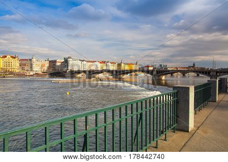 Prague Czech Republic - March 20 2017: View on the Prague panorama with Jirasek bridge at sunset.The Prague bridges arching over the Vltava River are not only vital connecting links but also valuable works of architecture .