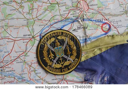 Chevron of Ukraine army.Back-Map of Ukraine  with location of Balakleya .Place of arsenal explosion at 23 march. 138 kT. of TNT power.March 23 ,2017 in Kiev, Ukraine