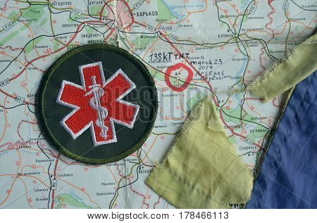 Chevron of Ukraine army.Back-Map of Ukraine  with location of Balakleya .Place of arsenal explosion at 23 march. 138 kT. of TNT power.March 23 ,2017 in Kiev, Ukraine