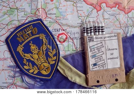 Chevron of Ukraine army.Back-Map of Ukraine  with location of Balakleya .Place of arsenal explosion at 23 march. 138 kT. of TNT power.March 23 ,2017 in Kiev, Ukraine
