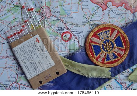 Chevron of Ukraine army.Back-Map of Ukraine  with location of Balakleya .Place of arsenal explosion at 23 march. 138 kT. of TNT power.March 23 ,2017 in Kiev, Ukraine