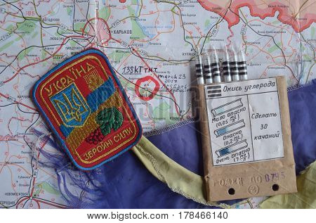 Chevron of Ukraine army.Back-Map of Ukraine  with location of Balakleya .Place of arsenal explosion at 23 march. 138 kT. of TNT power.March 23 ,2017 in Kiev, Ukraine