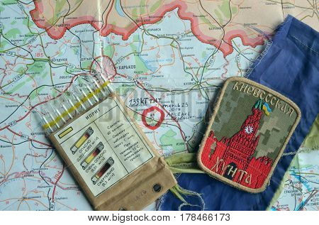Chevron of Ukraine army.Back-Map of Ukraine  with location of Balakleya .Place of arsenal explosion at 23 march. 138 kT. of TNT power.March 23 ,2017 in Kiev, Ukraine