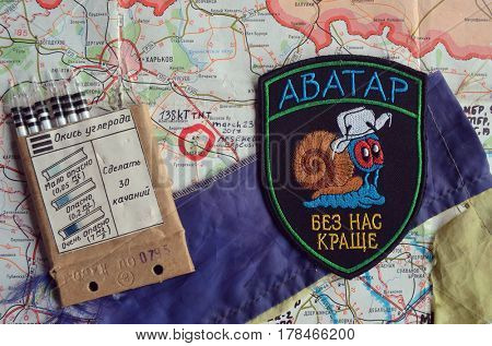 Chevron of Ukraine army.Back-Map of Ukraine  with location of Balakleya .Place of arsenal explosion at 23 march. 138 kT. of TNT power.March 23 ,2017 in Kiev, Ukraine