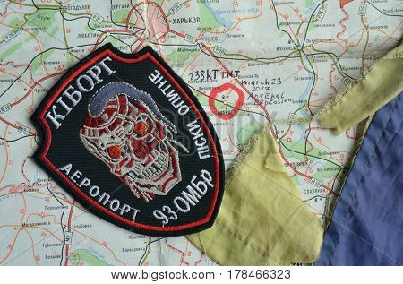 Chevron of Ukraine army.Back-Map of Ukraine  with location of Balakleya .Place of arsenal explosion at 23 march. 138 kT. of TNT power.March 23 ,2017 in Kiev, Ukraine