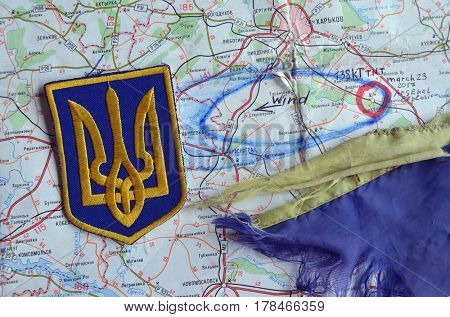 Chevron of Ukraine army.Back-Map of Ukraine  with location of Balakleya .Place of arsenal explosion at 23 march. 138 kT. of TNT power.March 23 ,2017 in Kiev, Ukraine