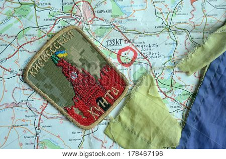 Chevron of Ukraine army.Back-Map of Ukraine  with location of Balakleya .Place of arsenal explosion at 23 march. 138 kT. of TNT power.March 23 ,2017 in Kiev, Ukraine
