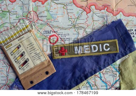 Chevron of Ukraine army.Back-Map of Ukraine  with location of Balakleya .Place of arsenal explosion at 23 march. 138 kT. of TNT power.March 23 ,2017 in Kiev, Ukraine