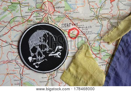 Chevron of Ukraine army.Back-Map of Ukraine  with location of Balakleya .Place of arsenal explosion at 23 march. 138 kT. of TNT power.March 23 ,2017 in Kiev, Ukraine