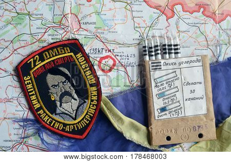 Chevron of Ukraine army.Back-Map of Ukraine  with location of Balakleya .Place of arsenal explosion at 23 march. 138 kT. of TNT power.March 23 ,2017 in Kiev, Ukraine