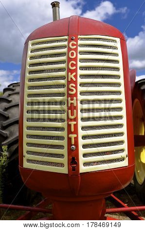 DETROIT LAKES, August 4, 2016: The red Cockshutt tractor with a white grill was a product of Cockshutt Farm Equipment Limited (1957-1962), based in Brantford, Ontario, Canada.
