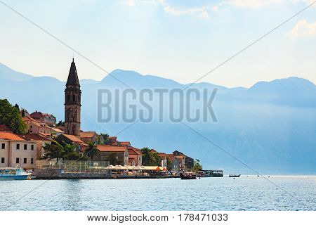 Waterfront of Perast old town against mountains in Bay of Kotor, Montenegro.
