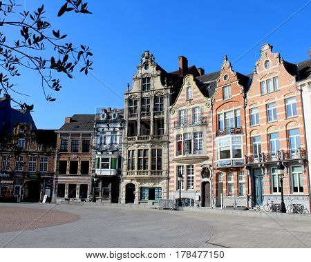DENDERMONDE, BELGIUM, MARCH 27 2017: Historic buildings which surround the main Market Place (Grote Markt) in Dendermonde, a town in East Flanders, Belgium.