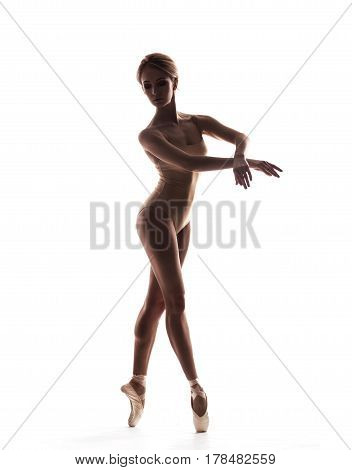 Ballerina in black outfit posing on toes. isolated on white studio background.