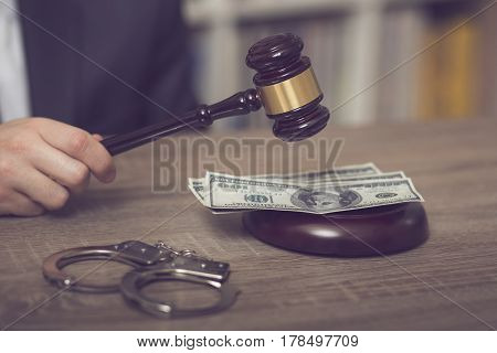 Detail of a corrupted judge saying a verdict on court. Selective focus